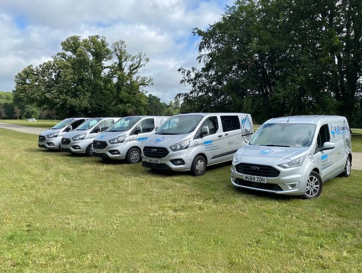 The Plumbusters van fleet lined up