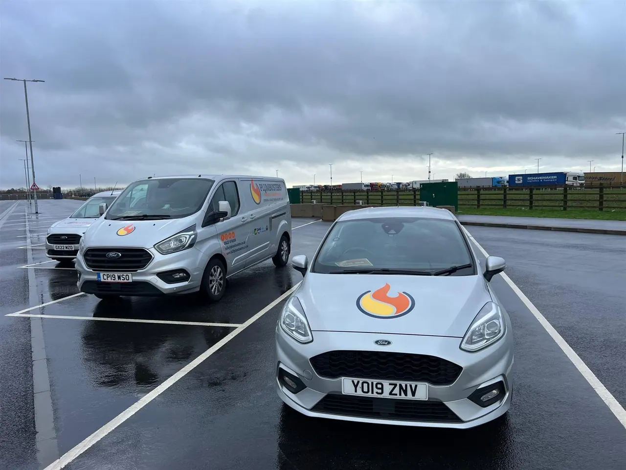 The Plumbusters fleet in the current orange livery